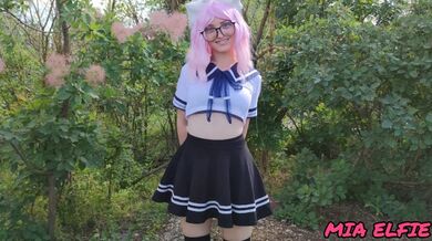 Sexy schoolgirl with ears in uniform walks down the abandoned road